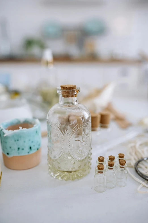 a glass bottle of alcohol with other bottles in the background