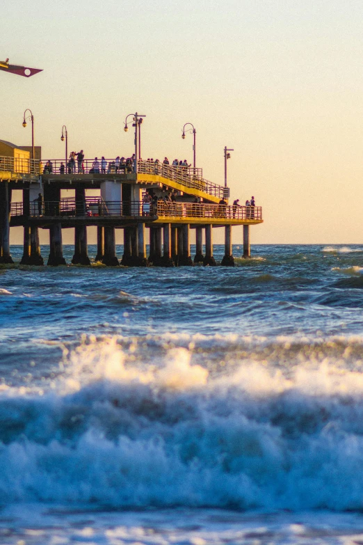 a ship is leaving the pier with its wheels out