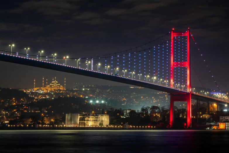 the night lights of the bay bridge are lit up