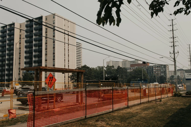 view of construction at an intersection with building in the background