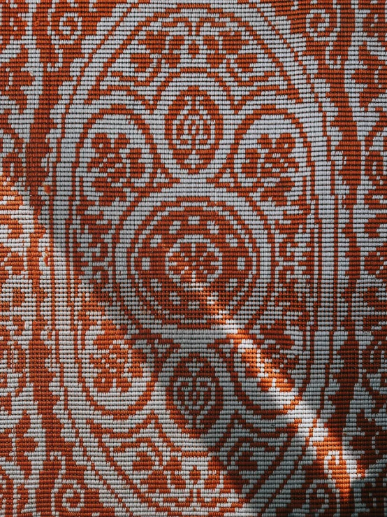 an image of an orange and white floral print