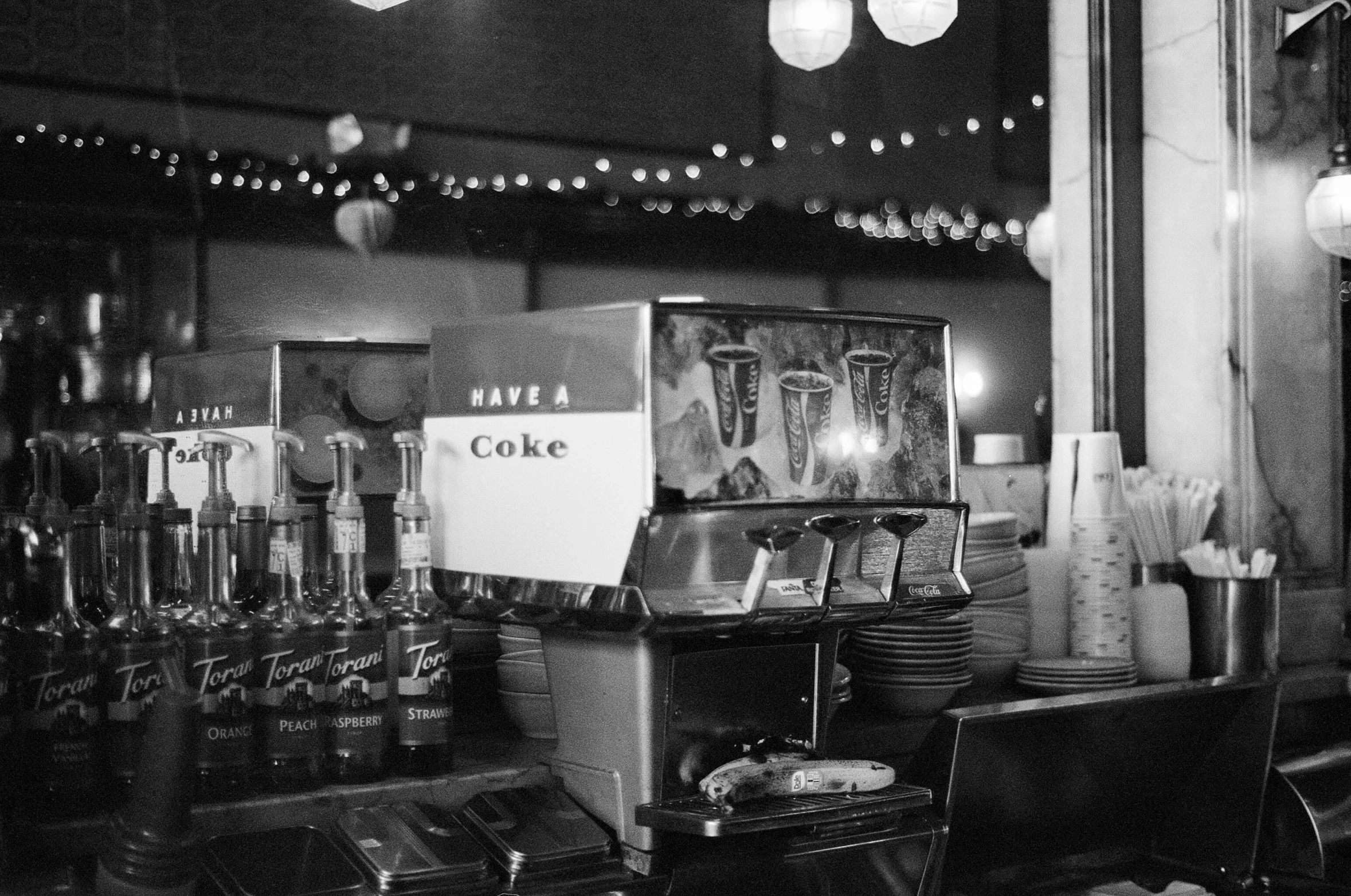 black and white pograph of coke vending machine