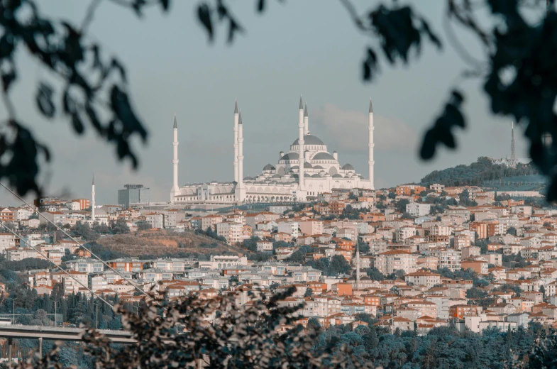 a white city is in the middle of a forest