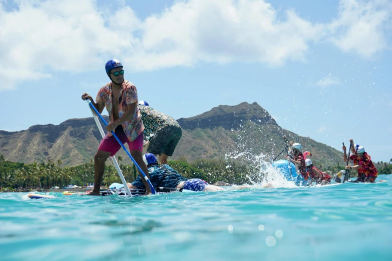 some people are playing in the water with their paddles