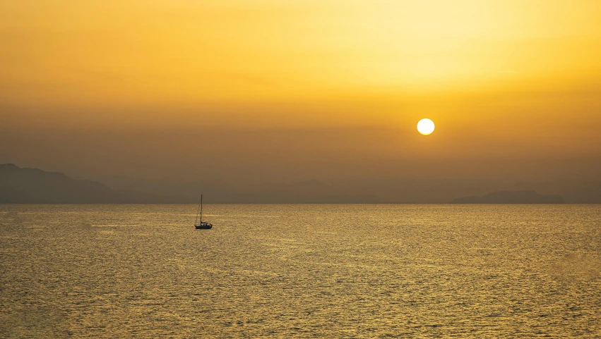 a po of the sun setting over the ocean