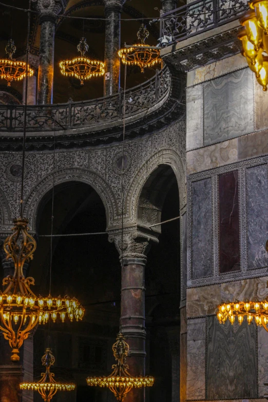 a large chandelier inside of a building with several lights