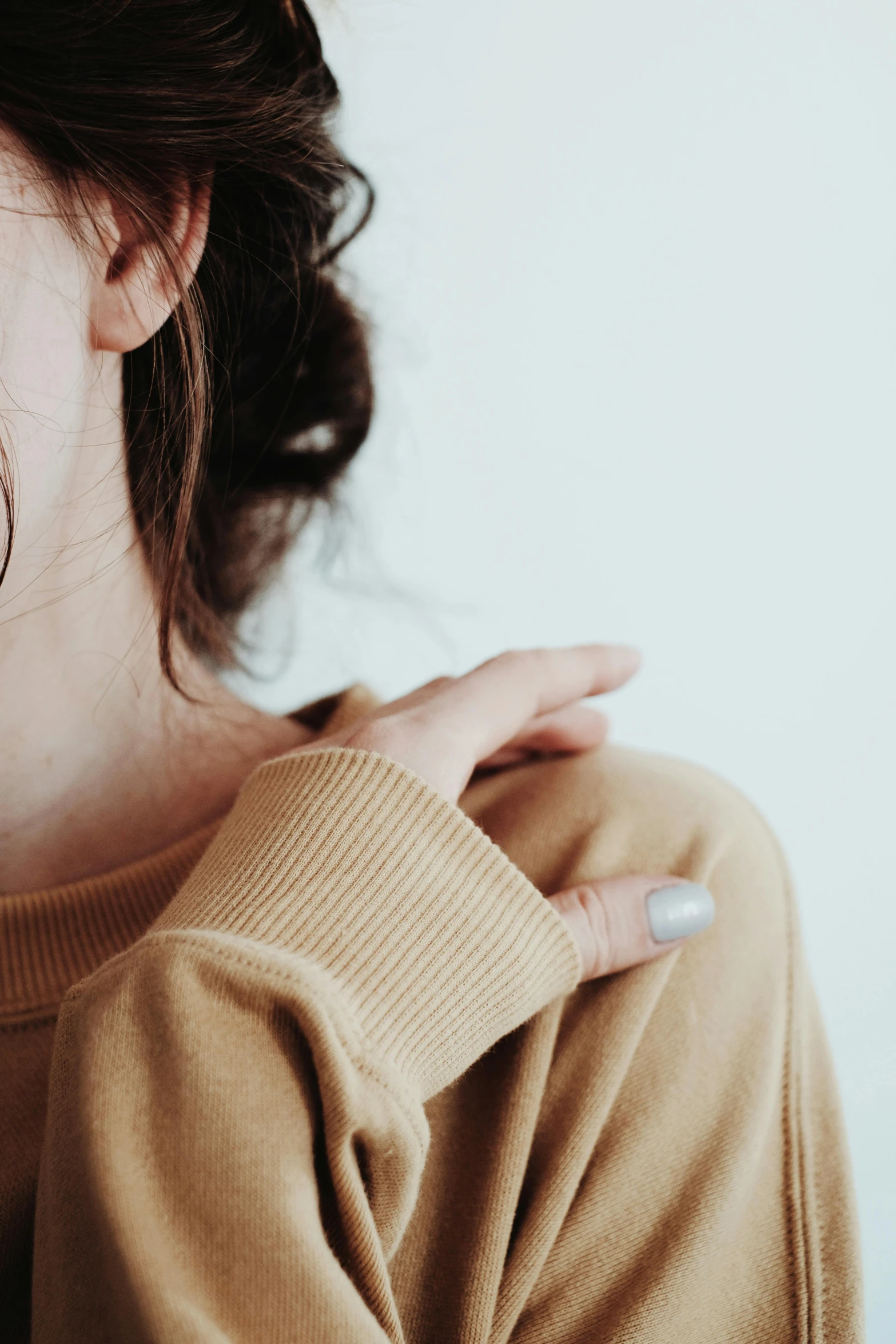 the woman is showing off her ring on her finger