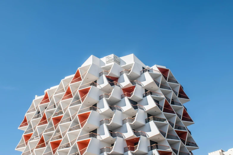 several red and white balconies sitting on top of each other