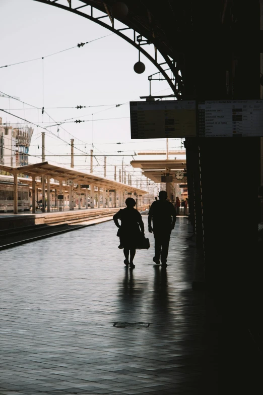 two people that are walking next to each other