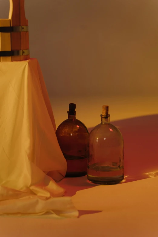 some bottles and a cloth are sitting by each other