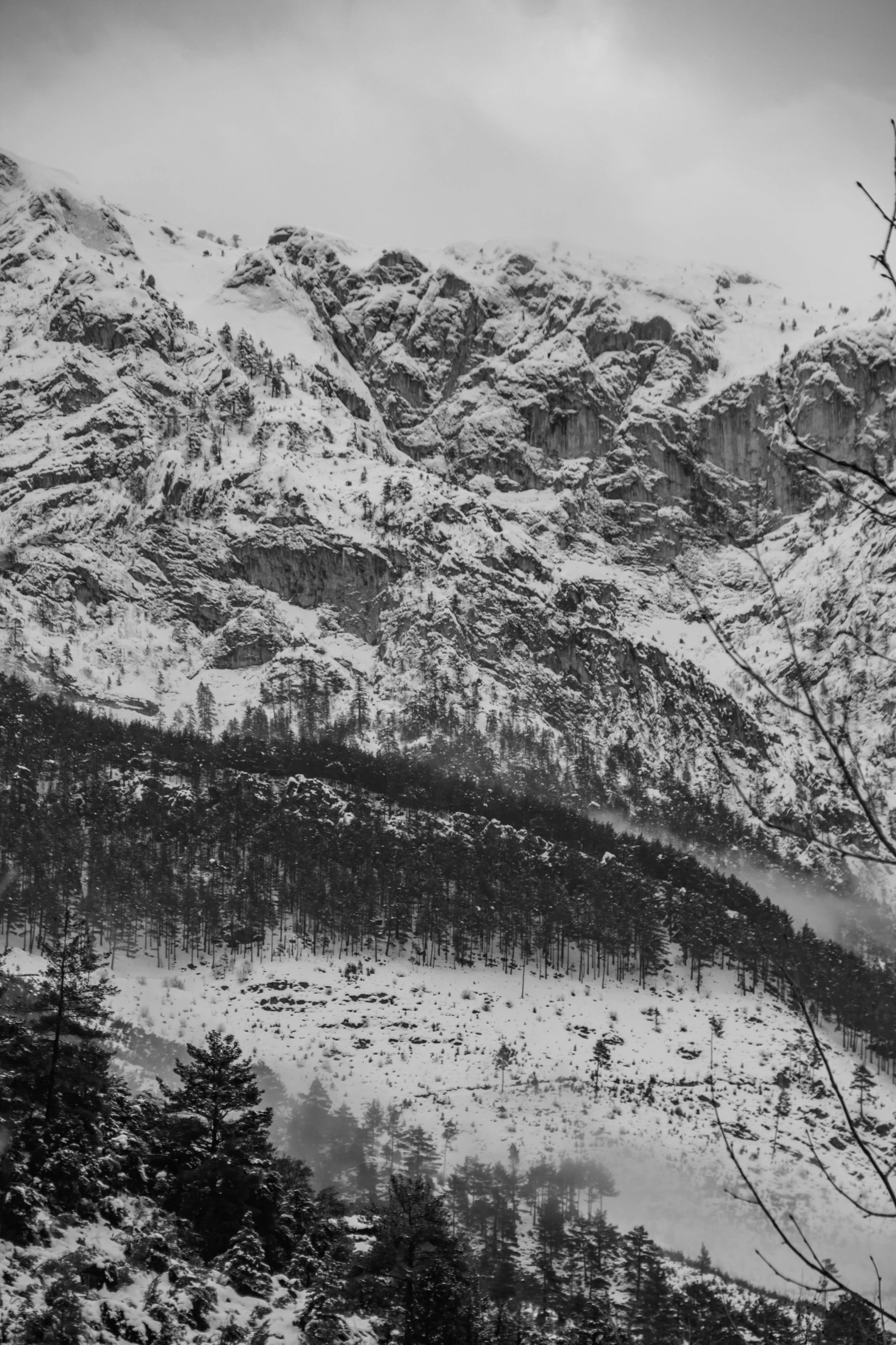 the mountain landscape is covered in snow