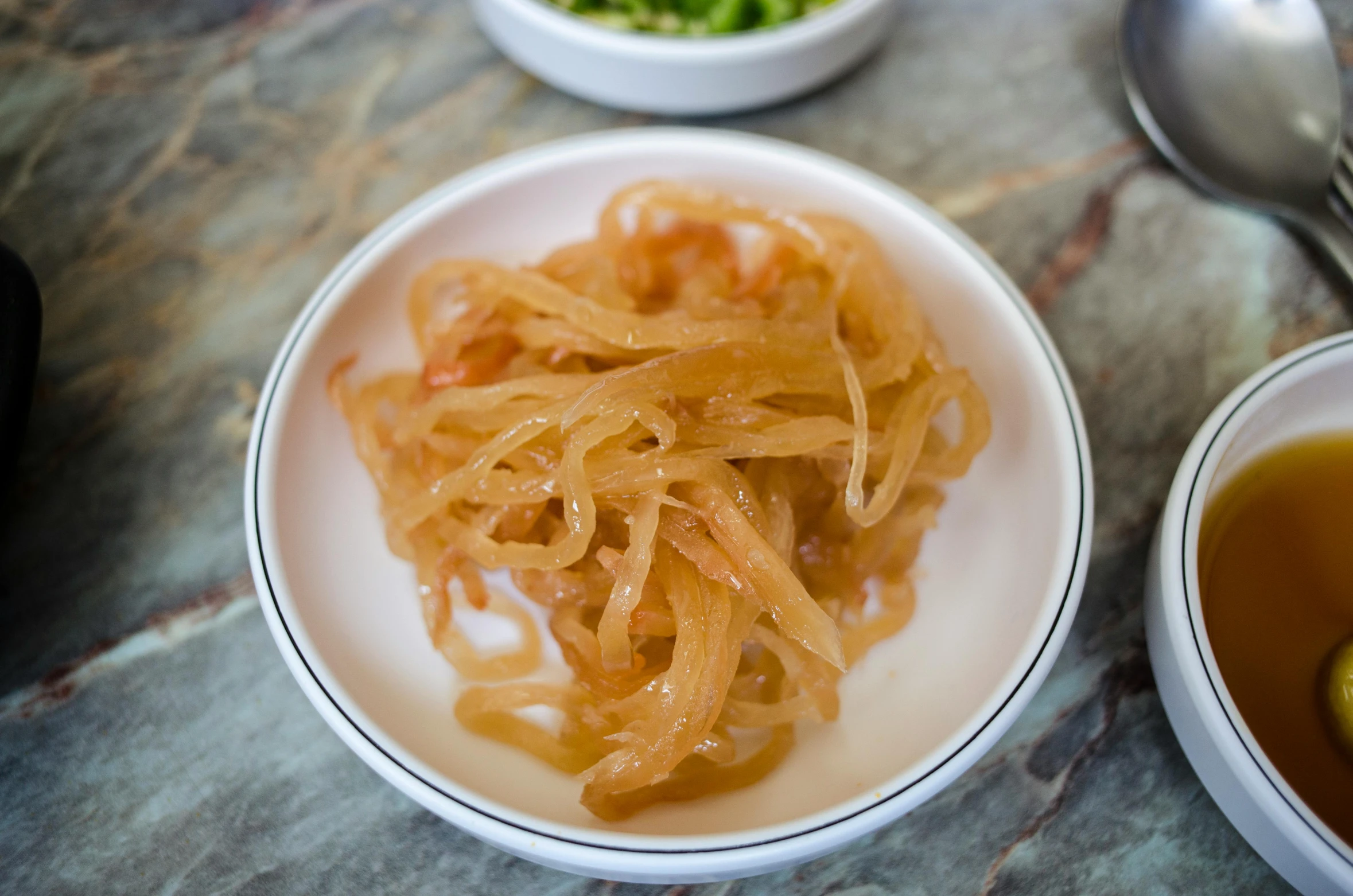 a plate of noodles sits on the table