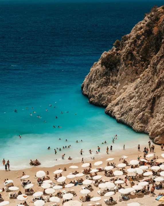 there are people enjoying the beach and the water