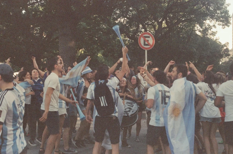 many young people wearing soccer jerseys in a group