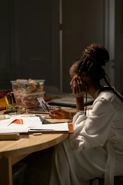 a woman at her desk using her phone