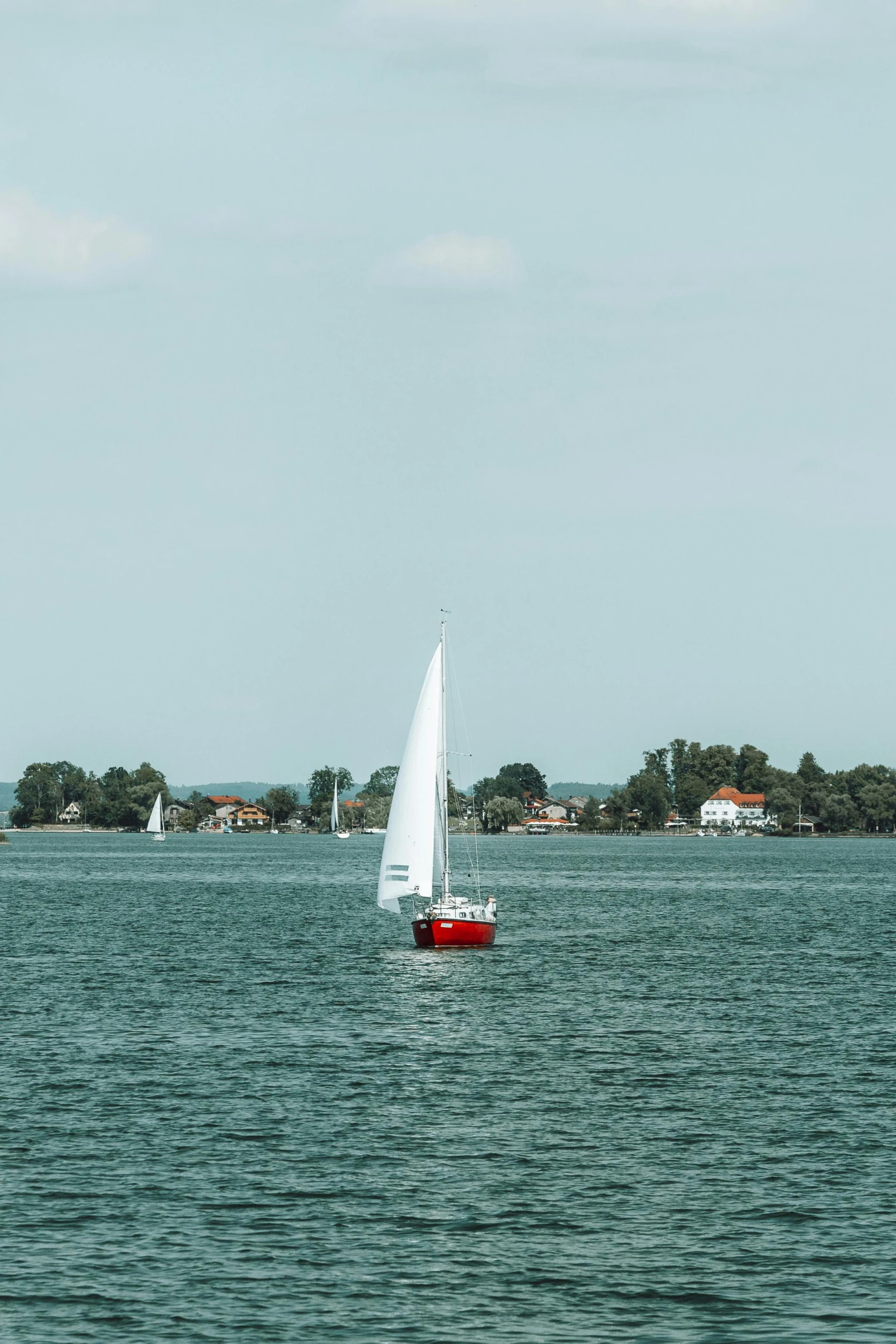 an image of a sail boat out on the water