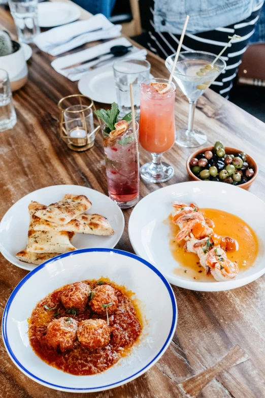 a table topped with two plates filled with food