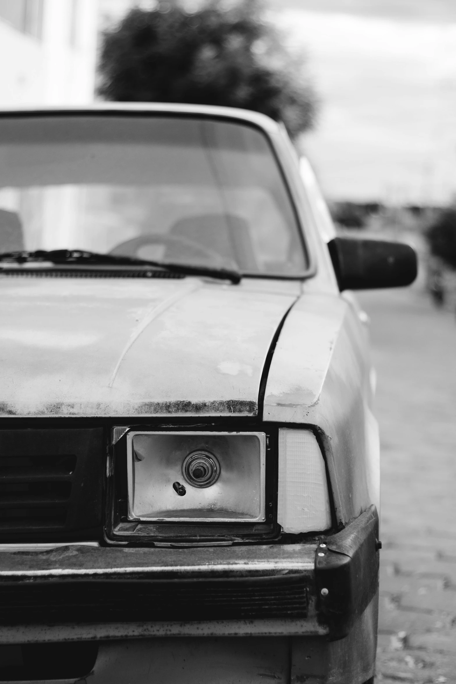 a black and white pograph of an old vehicle