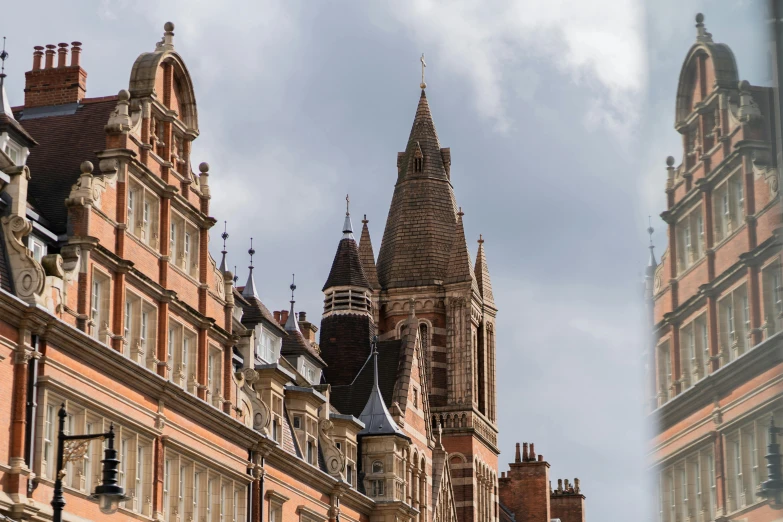 the front of a large, ornate building, with many spires