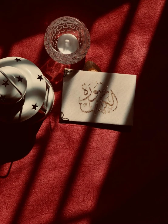 a table topped with plates and a cup filled with saucer