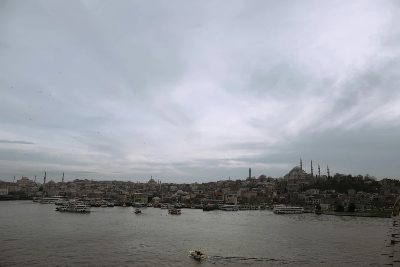 a large body of water with a bunch of boats floating on it