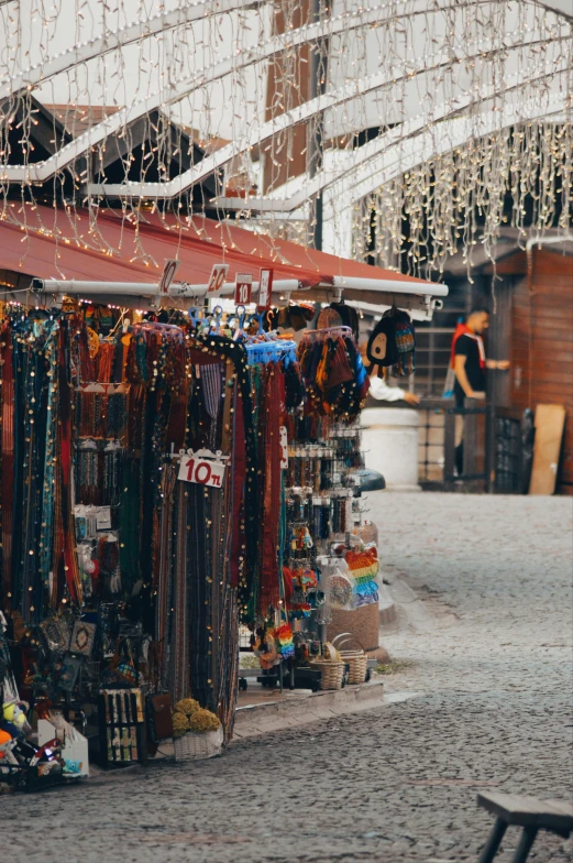 a small street vendor displays ties and necklaces