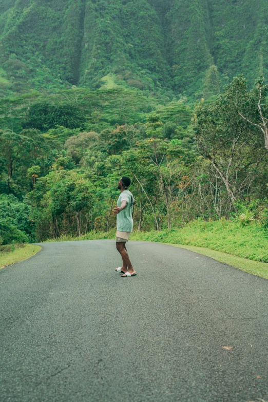 a skateboarder is riding on a winding road