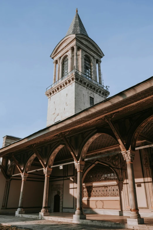 an ornate building with pillars and a tower