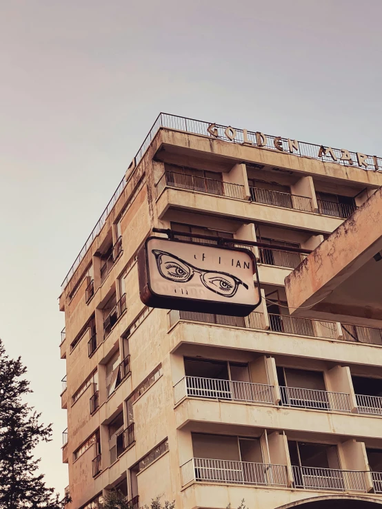 an old building with a street sign on the side