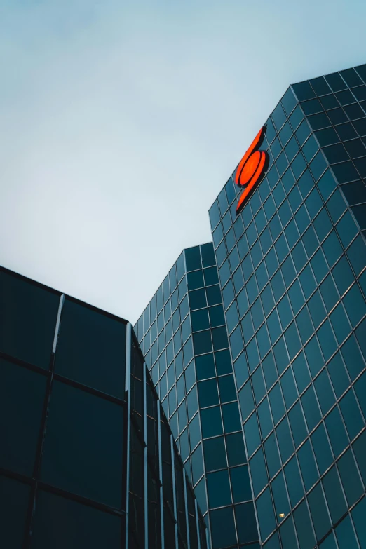 a large building with a red sign attached to the side