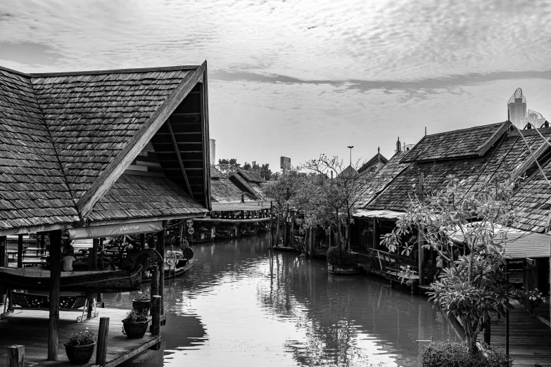 the water is running along the wooden houses