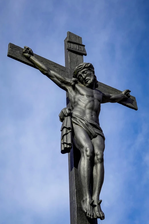 a cross is placed with an image of jesus on it