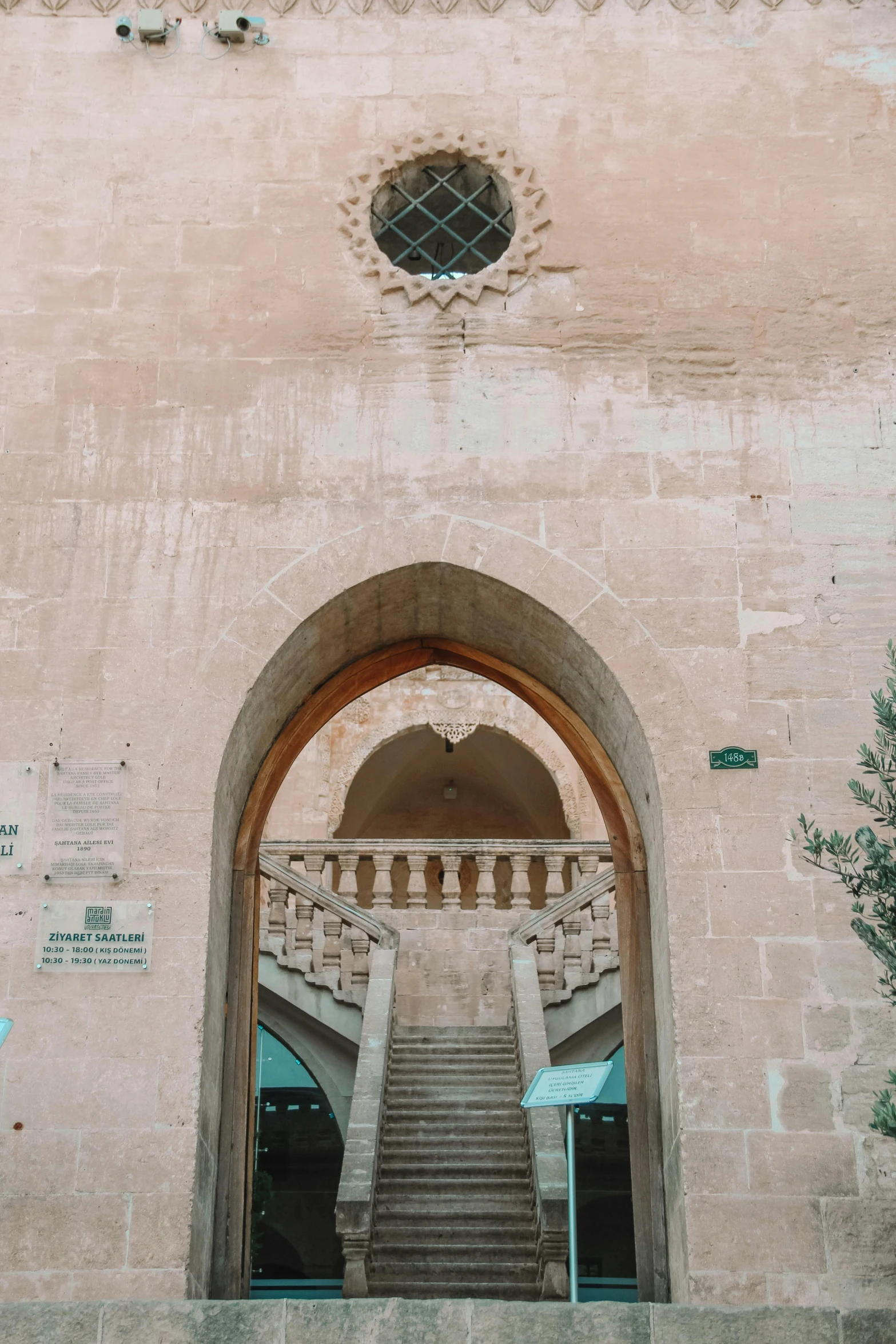 stairs lead to a portal and a few windows above