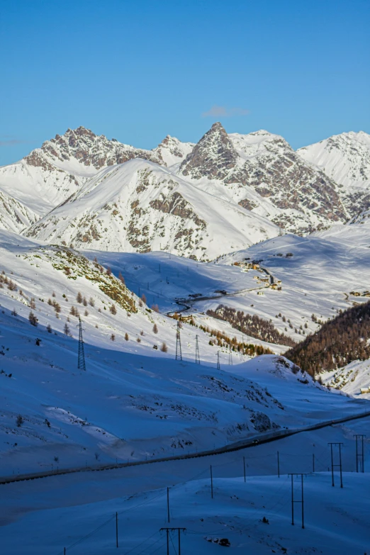 the view from the mountain shows mountains covered in snow