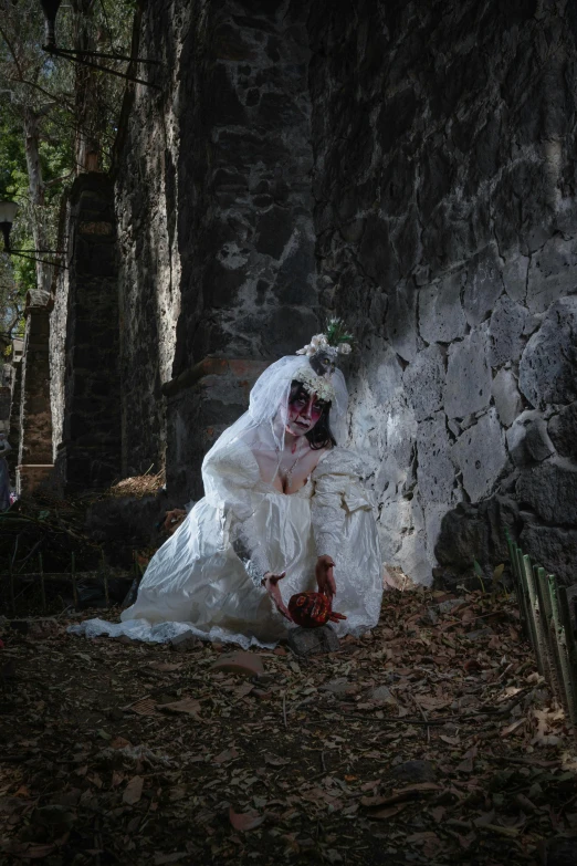 a lady in a white dress is posing for a po