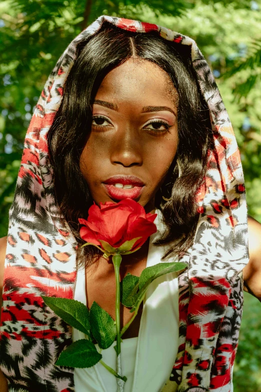 a woman in the middle of a red rose