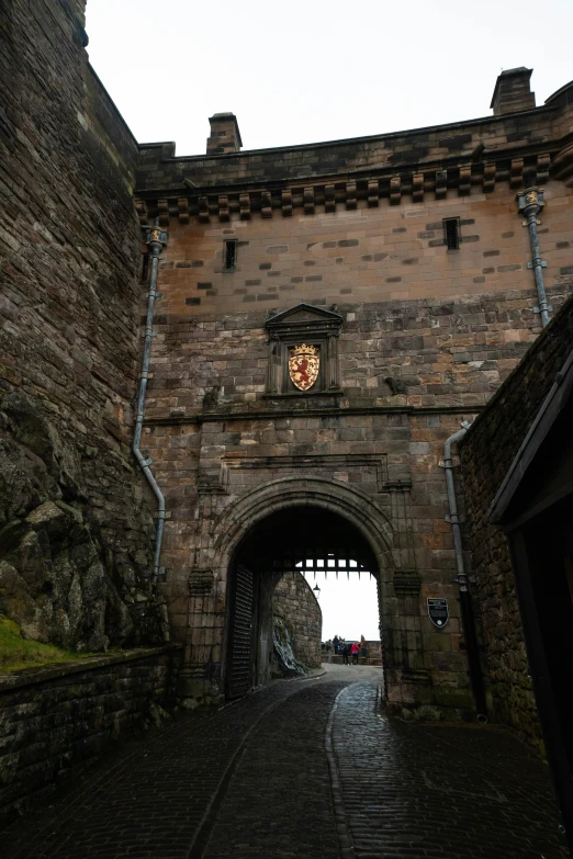 two brick tunnels leading into a stone building