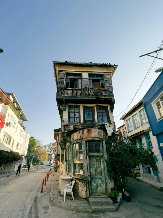 two buildings sitting on the side of a street next to each other