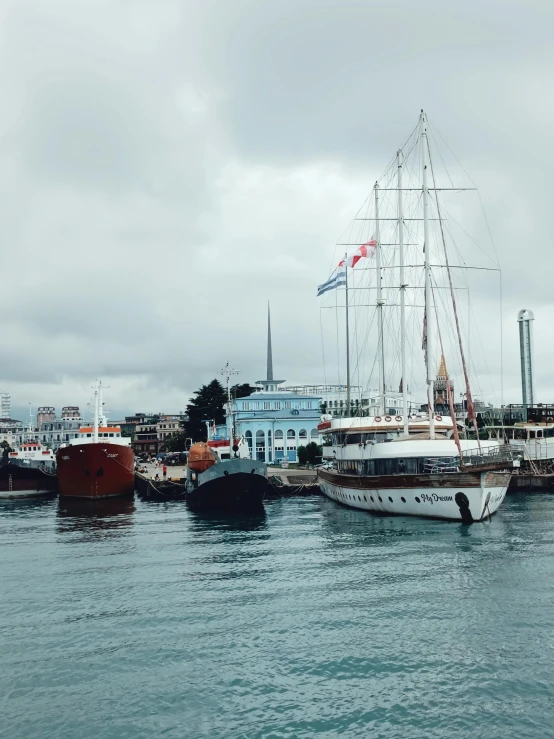 several large boats sitting in the water together