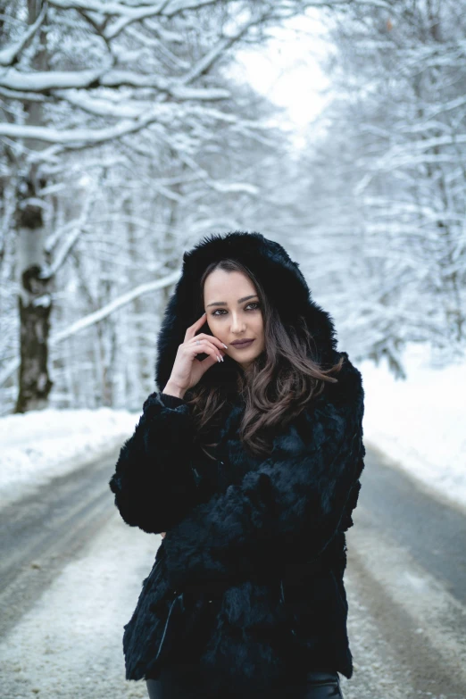 there is a woman walking through the snow