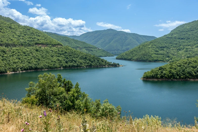 a view of a mountain lake in the mountains