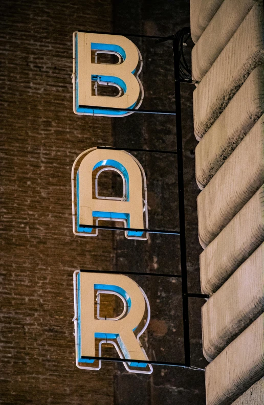 this sign has two letters that read bar and q