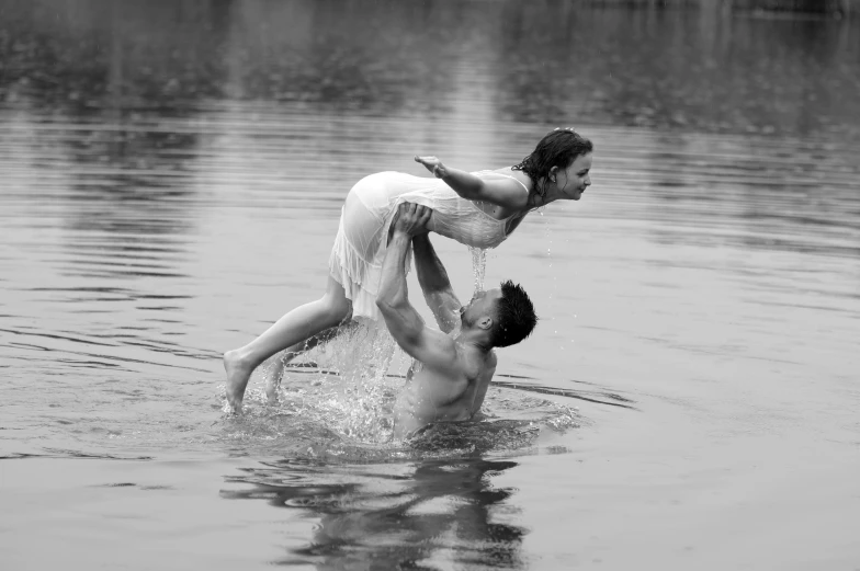 two people are in the water playing