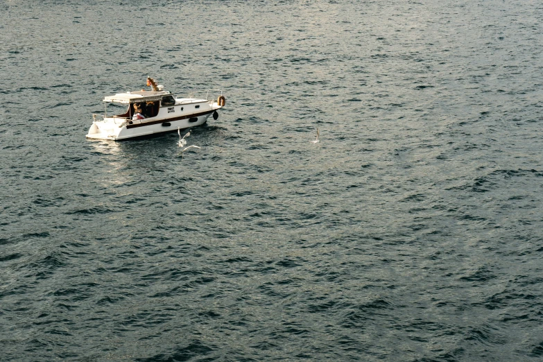 boat in calm lake with two men riding