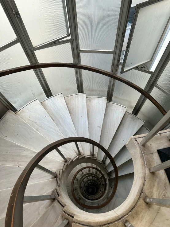 view from the bottom of a spiral stair case