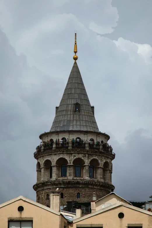 a building with a large spire that has lights on top