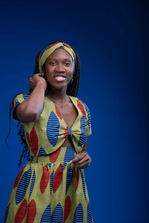 a woman smiling and holding her cell phone