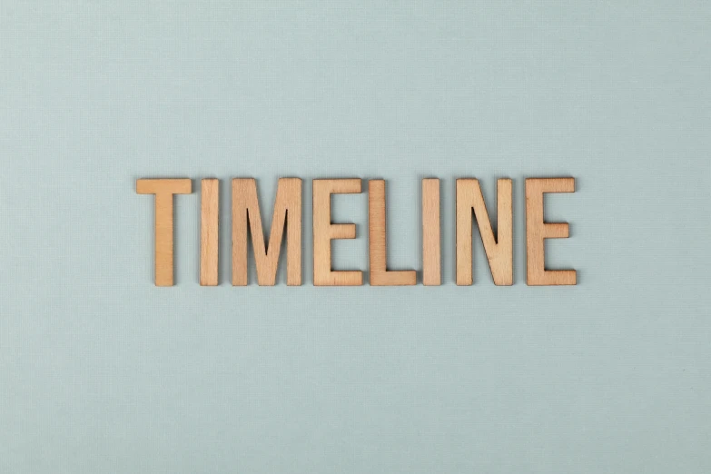 a blue background with wood type that spell out the word'timeline '