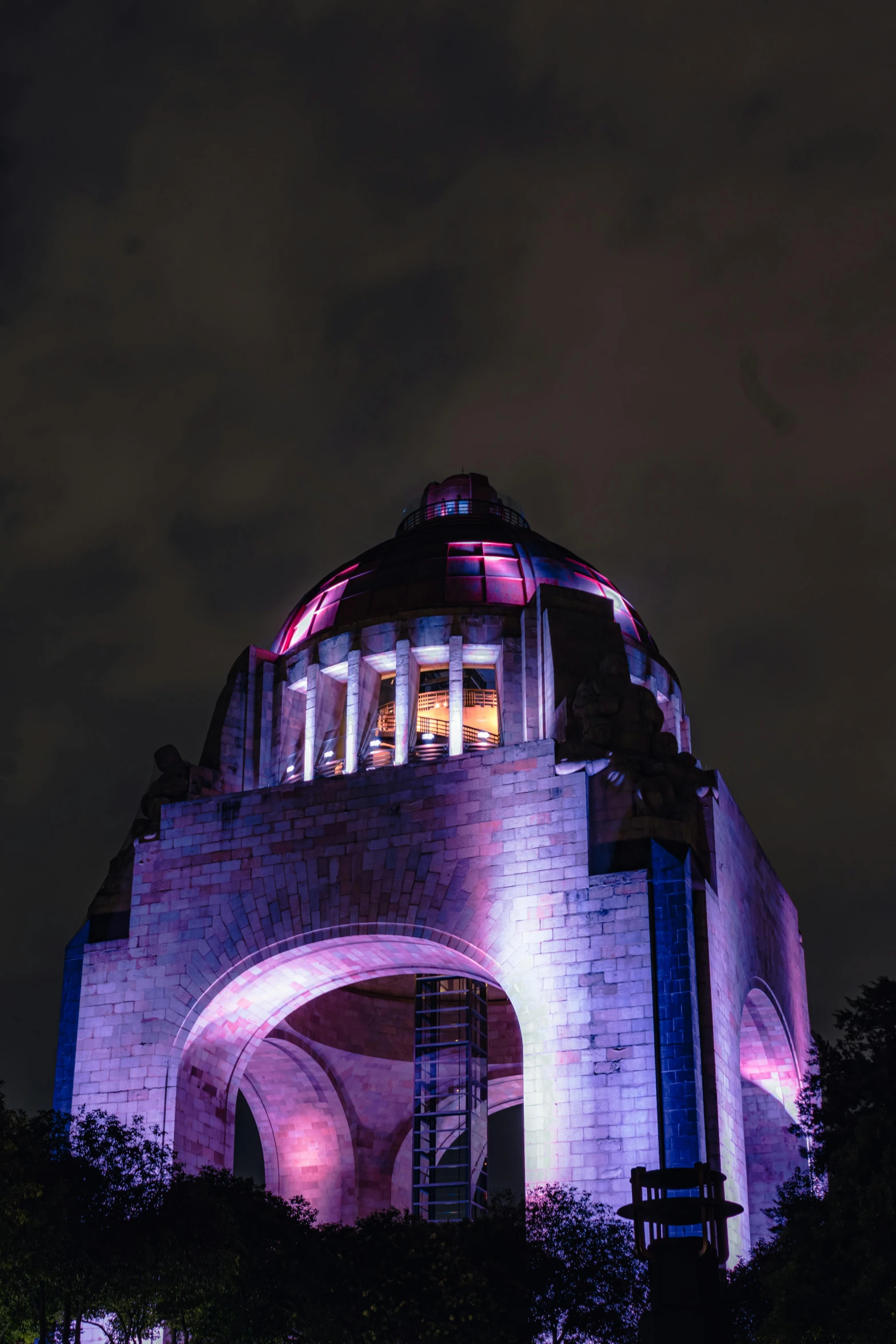 a large brick structure that has lights on it