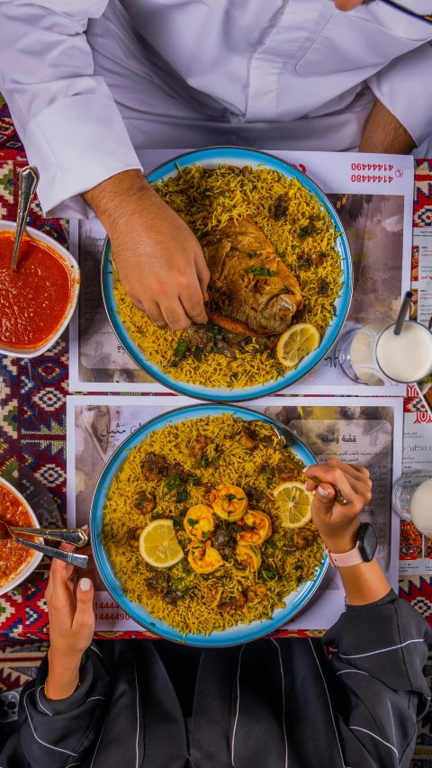 a couple of plates topped with a bunch of food